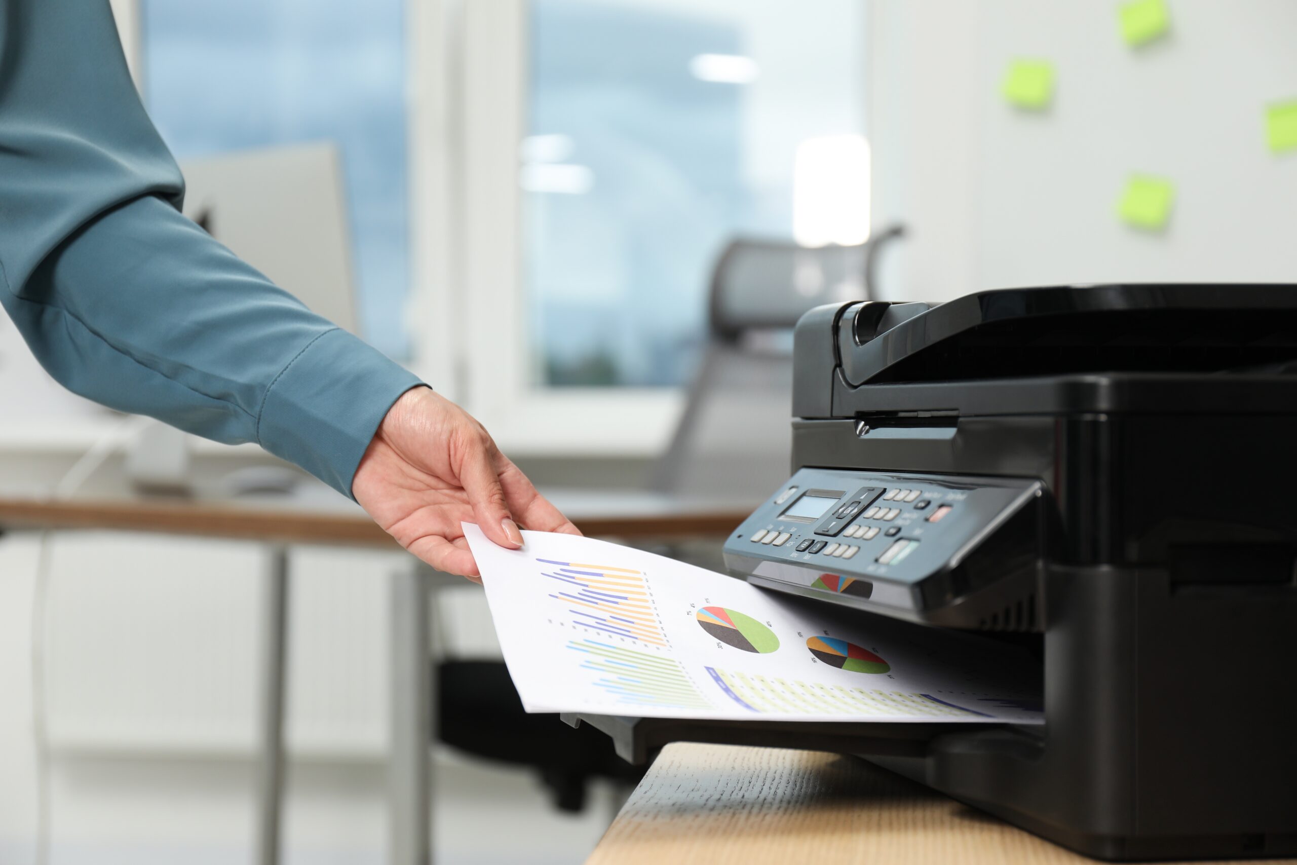Woman using a modern printer
